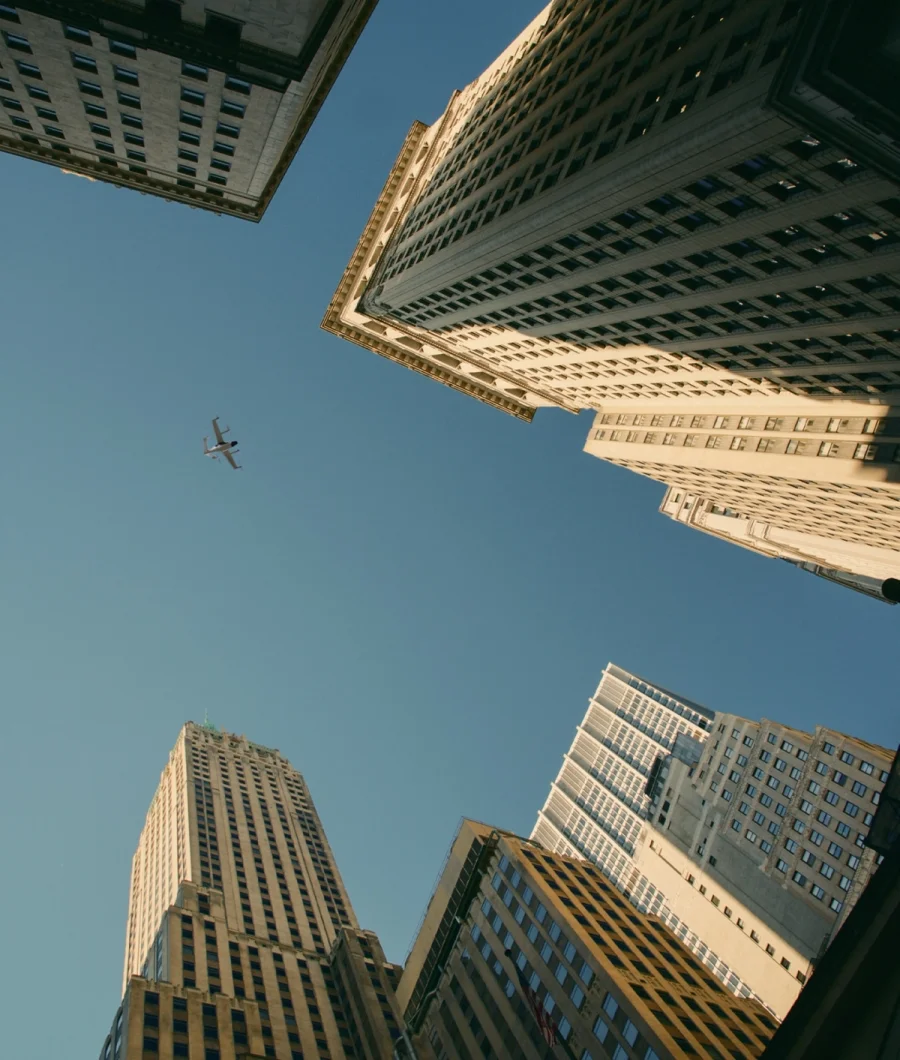 City skyline view from below with Joby aircraft flying