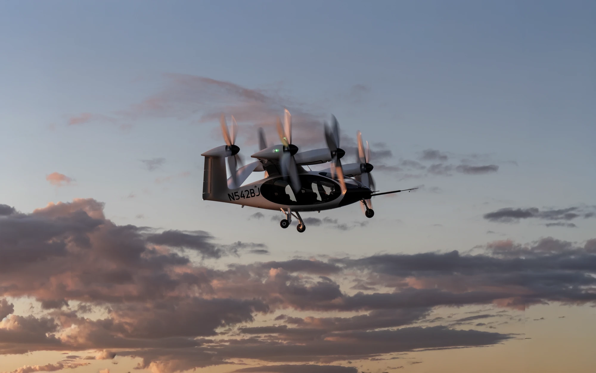 Joby S4 aircraft flying at sunset